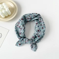 Detail of vintage floral cotton scarf with blue floral print and fine rolled edge seams - Cineraria Blue