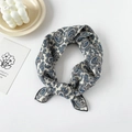 Detail of blue Paisley pattern on beige cotton silk square scarf with fine black hem edge - Blue Paisley Beige