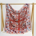 Red paisley square silk scarf with geometric floral patterns on a wooden display stand - 105*105cm / Red Flame Geometric