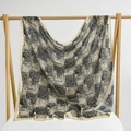 Elegant beige square scarf with black abstract geometric prints hanging on a wooden rack - 105*105cm / Woven Line Maze