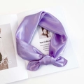 Detailed view of light purple satin scarf texture on a magazine background - Taro Purple