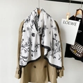 Detail of floral linen scarf paired with a trench coat showing soft texture and elegant print - Black (M8906)