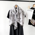 Detail of floral linen-cotton scarf with soft draped texture on wooden hanger - Gray (M8906)