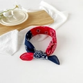 Macro view of red and navy paisley cotton bandana headband on a wooden tray - 50cm x 50cm / Navy and Red