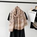 Close-up of the breathable cotton and linen scarf featuring exotic conch floral patterns - Coffee (M8905)