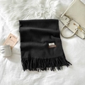 Elegant solid black cashmere scarf with fringe detailing and premium material label - Black