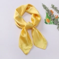 Elegant bright yellow faux silk square scarf tied in a stylish neck knot for women - Yellow