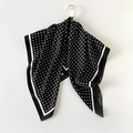 Classic black satin scarf with white polka dot pattern and elegant drape on hook - Black Polka Dot