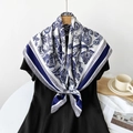 Blue and white paisley silk scarf draped over black dress in elegant lifestyle setting - Unkut Blue Paisley