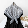 Gray and white silk scarf featuring a French map print tied on a black outfit - Gray White Map