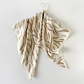 Square silk scarf with beige and brown zebra patterns hanging on a golden hook - Khaki Zebra Stripe