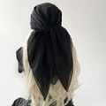Close-up of black pearl chiffon hijab showing translucent texture and tie-back knot - Black