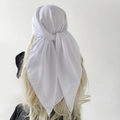 Rear view of a white chiffon triangular headscarf tied on light blonde wavy hair - Snow White