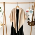 Detail of soft beige cotton-linen blend shawl featuring elegant fringe and minimalist style - Beige