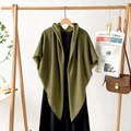 Detail of olive green shawl with fringe edges on a wooden hanger with black dress - Army Green