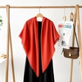 Detail of red hooded shawl with frayed edges and fringe in elegant cashmere-like texture - Orange Red