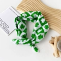 Cotton square scarf with green checkerboard and clover pattern tied in a knot - Clover Green