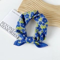 Floral cotton small square scarf in blue and green print tied in a stylish ring knot - Petal Flower Blue