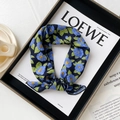 Blue camellia floral cotton silk scarf for women styled in a black display tray - Hibiscus Blue