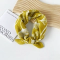 Mustard yellow cotton headscarf featuring white ginkgo leaf patterns and a knot detail - Ginkgo Leaf Yellow