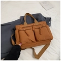 Detail of brown nylon tote bag with two 3D zip pockets and woven rope pullers - Brown