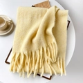 Soft pale yellow wool mohair scarf with fringe trim on white aesthetic background - Yellow