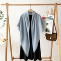 Light blue faux linen large shawl scarf with tassel edges on a wooden hanger - Azure