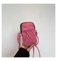 Detail view of the pink washed denim mini crossbody bag with a decorative knotted rope strap - One Size / Pink