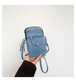 Detailed close-up of a blue washed denim crossbody mini phone bag with drawstring pocket - One Size / Light Blue
