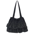 Bolso tote de lona negra con estampado floral amarillo y detalles de volantes a capas - Negro