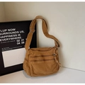Detail of vintage canvas crossbody bag with multiple front zipper pockets and wide strap - Brown