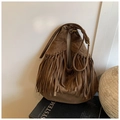Macro detail of brown suede crescent hobo bag featuring dense fringe tassel decoration - One Size / Brown