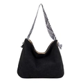Black corduroy hobo tote bag featuring a black and white geometric pattern shoulder strap - Black