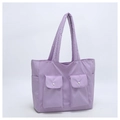 Detail of lavender large capacity quilted tote bag showing double front snap pockets - Purple