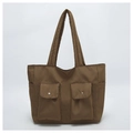 Detailed view of the dark brown canvas tote bag featuring dual front cargo flap pockets - Khaki