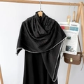 Detail of herringbone pattern silk scarf with hand-rolled edges on a wooden hanger - Line Black