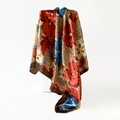 Close-up of elegant floral print silk satin square scarf draped on white geometric stand - Brown