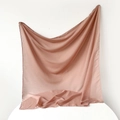 Detailed view of soft dusty pink silk scarf showing smooth satin texture and fine hemmed edges - 95x95cm / Dusky Pink