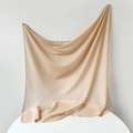 Detail of champagne gold satin scarf showing silky texture and smooth hemmed edges - 95x95cm / Nude