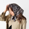 Detailed close-up of grey leopard print satin headscarf tied in hair on a model - L7377-Gray Leopard