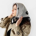 Detail of silk-satin square scarf featuring black and white paisley print on head - L7387-Black Floral