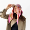 Detail of floral satin scarf styled with a pink baseball cap and khaki trench coat - L7114-Pink Floral