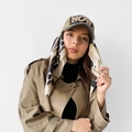 Detail of khaki baseball cap with NOW LOVE embroidery styled with a classic trench coat - 70x70cm / L7389-Khaki