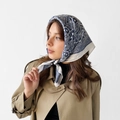 Detailed view of navy paisley satin scarf tied as a French headscarf for elegant styling - L7394-Blue Paisley