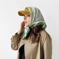 Detail of green and white striped satin scarf paired with a ginger yellow baseball cap - L7212-Green Stripe