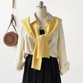 Detail of a ginger yellow cable knit shawl draped over a minimalist white shirt - 102*46cm / Yellow
