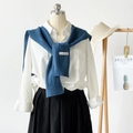 Detailed view of dark blue knit shawl over white collared shirt with Bonogeed brand tag - Dark Blue