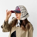 Close-up of black polka dot silk scarf styled with a vintage 1969 embroidery baseball cap - L7029-White Polka Dot