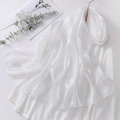 Detail of white organza headscarf with satin sheen draped over a classic white shirt - White
