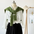 Grass green hollow knit shawl with BONOGEED label over a white shirt and black skirt - Green